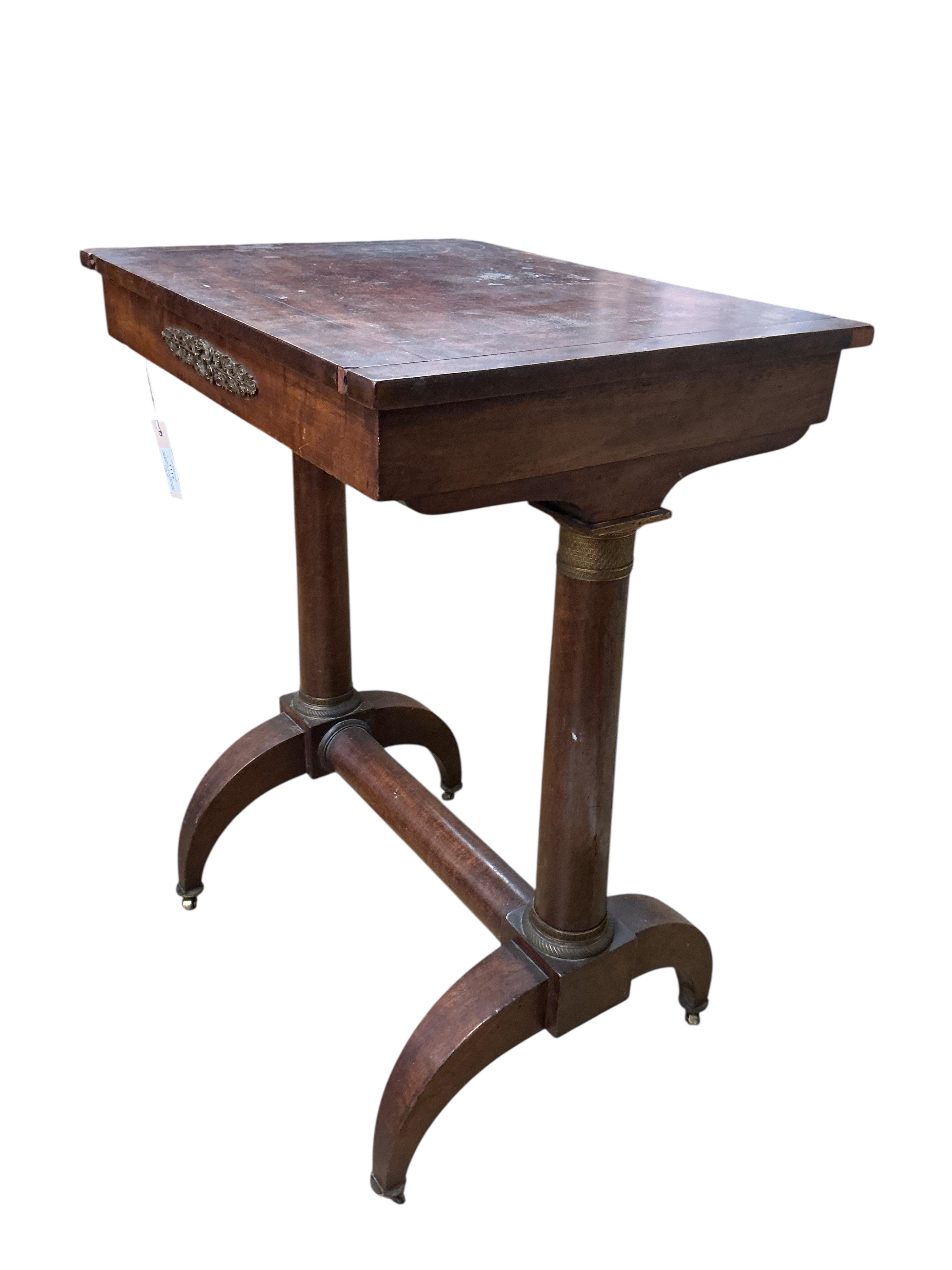 An early 19th century French gilt metal mounted mahogany games table, width 54cm, depth 41cm, height 70cm. Condition - fair